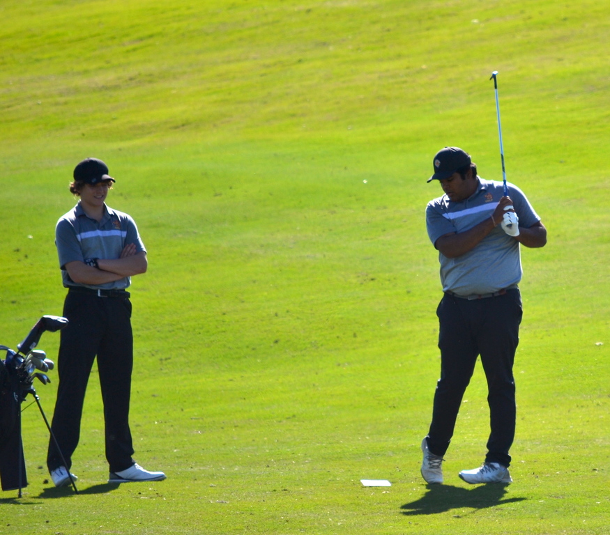 Ethan and Adesh having a great day playing golf.