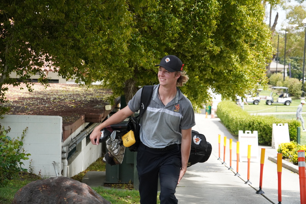 Kal walking up to the tee box to start day 2 at the Trinity League Tournament.