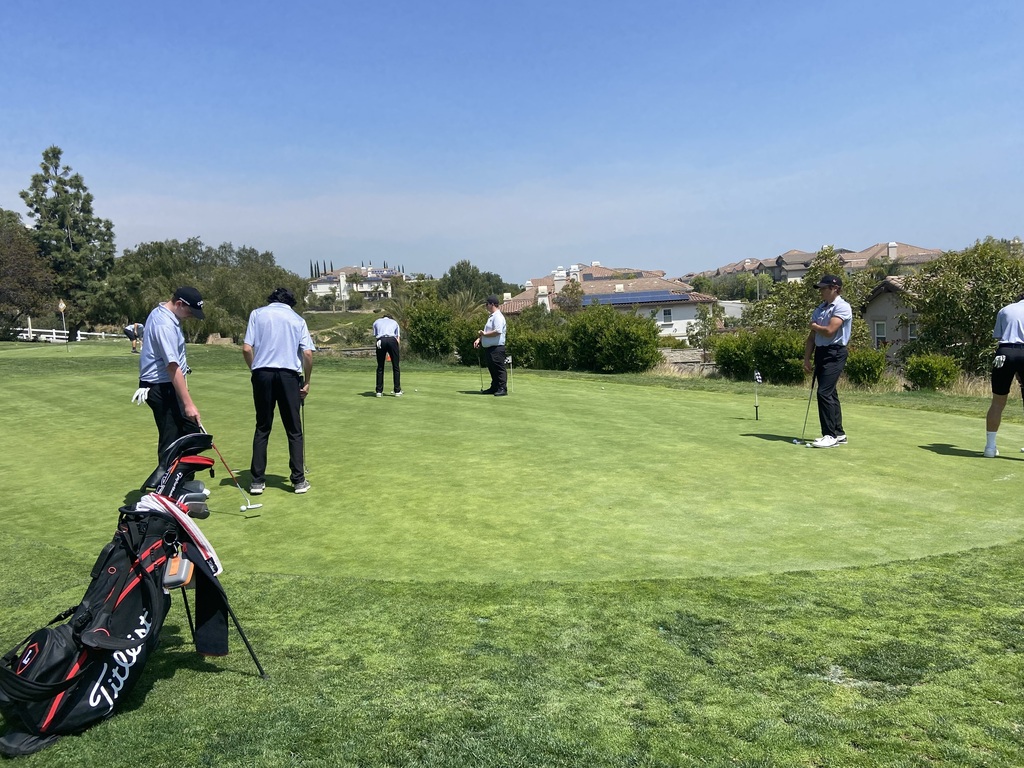 Boys JV warming up to play at Black Gold Golf Course against Orange Lutheran