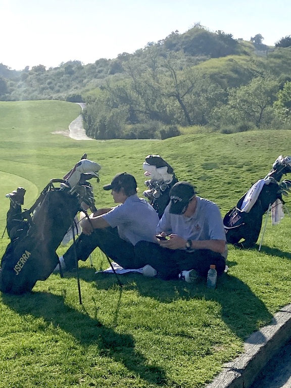 Ethan and Colton relaxing after a great round of golf