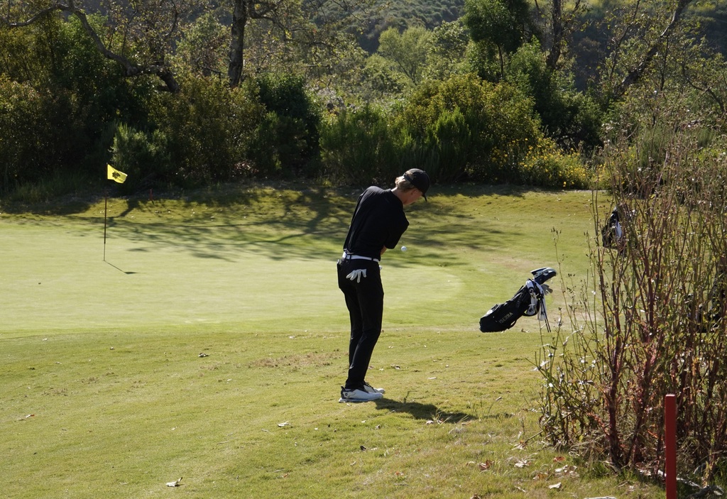 Reece with his chip on hole 2.