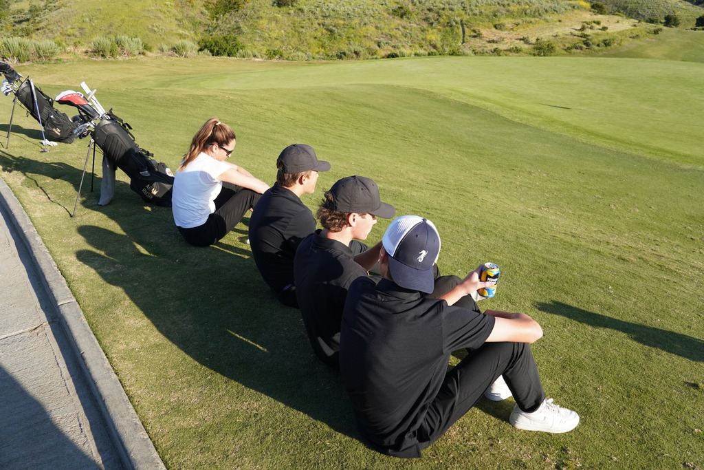 Watching the rest of the team finish up the last home match of the season.