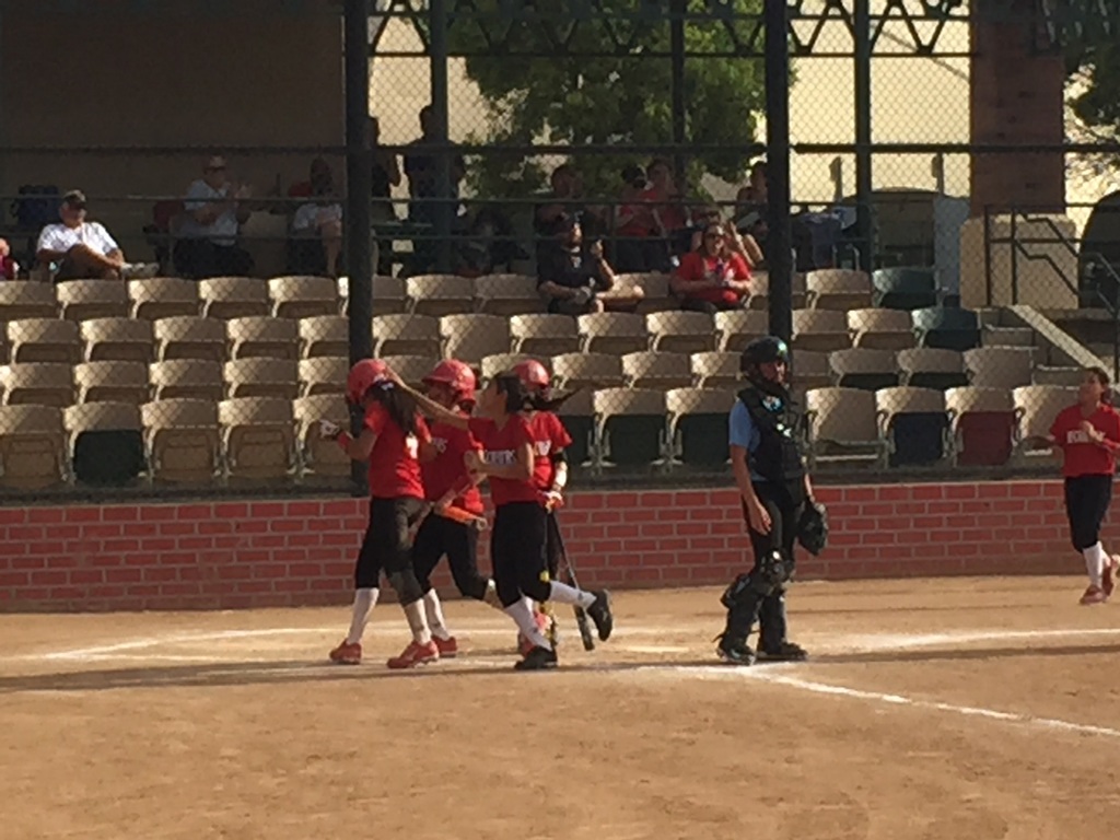 Natalie celebrates a home run, Firecrackers up 10-1