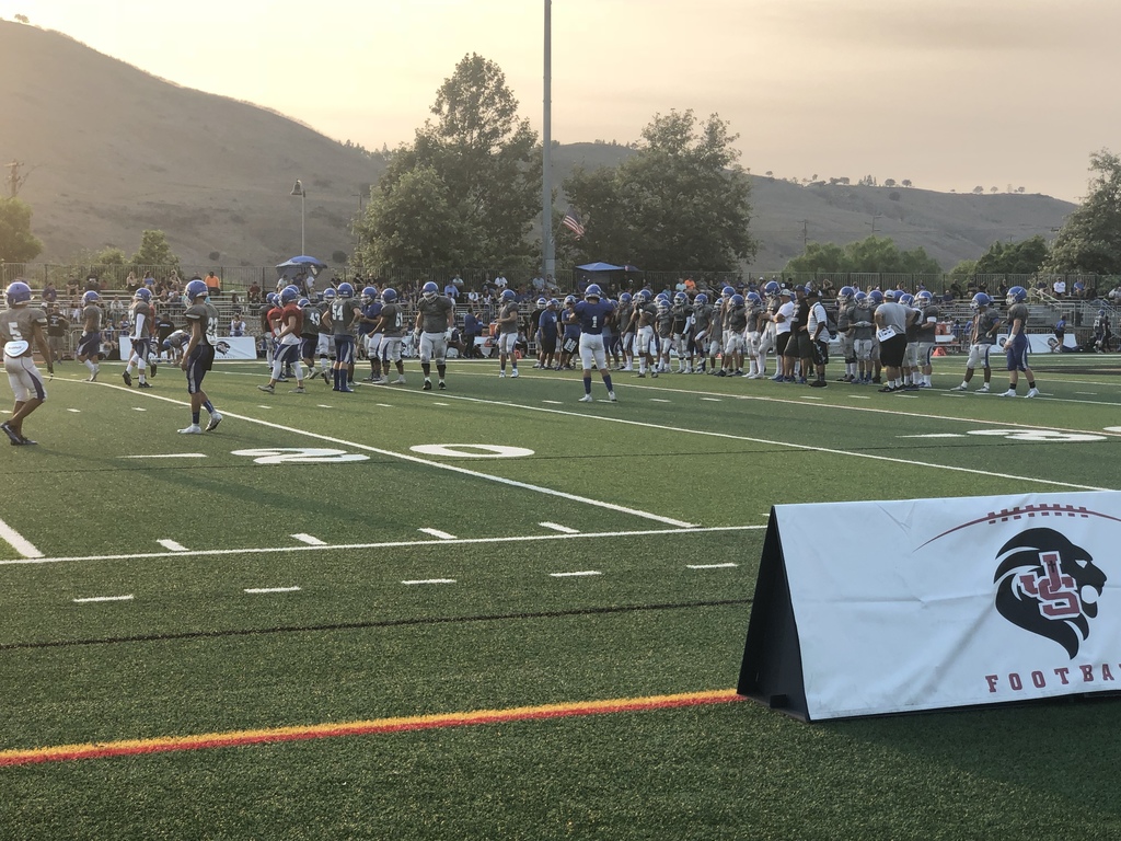 Norco Varsity Football warming up for their scrimmage at Jserra