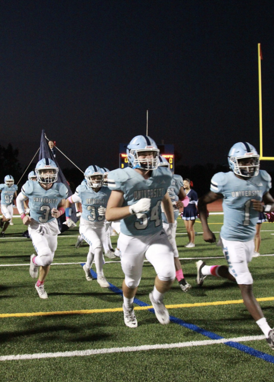 Led by #1 Senior Captain Justin Tribble the Trojans bust through the banner as they take the field for their first Omnicron League Game against Pacifica High School.