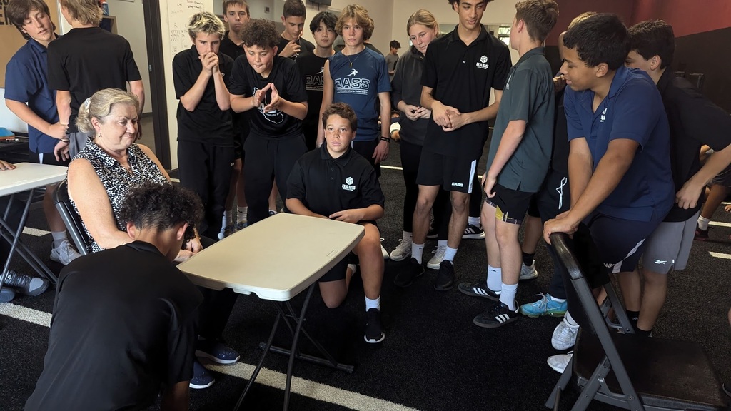 October 11, 2024 brought Squad Games around again for Paper Football...the crowd gathers 🤩👀 while Mrs. B refs while Braeden & Jackson get set up.