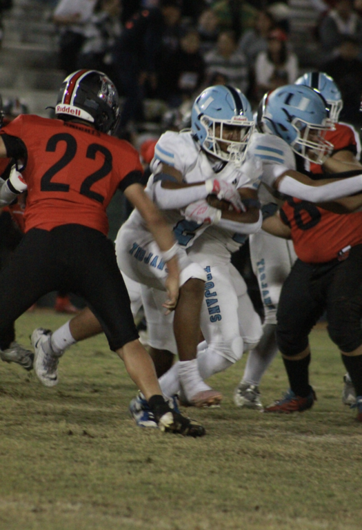 #2 Varsity running back Damari Carter busts through the defensive line of the Knights on way to a 100 yard game, the second for him for the season. Damari ends the season with 675 yards the second highest of all running backs in the Omnicron League.