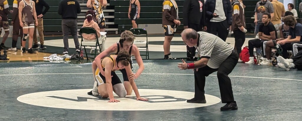 Varsity Gold action against South Lyon East