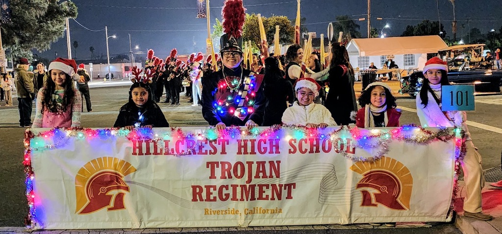 FUTURE TROJANS (LIL ELVES) HELD OUR BANNER. THEY WERE ADORABLE!