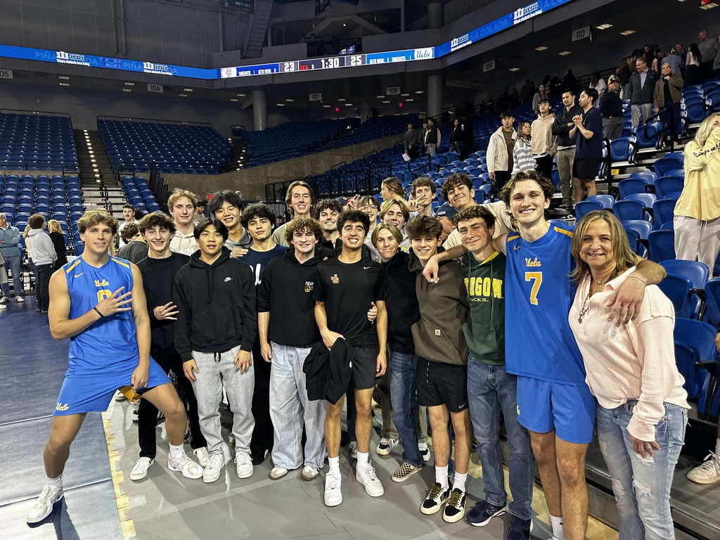 Members of the 2024-2025 JSerra Boys Volleyball program visit with JSerra Alums Andrew Rowan and Trent Taliaferro after the game