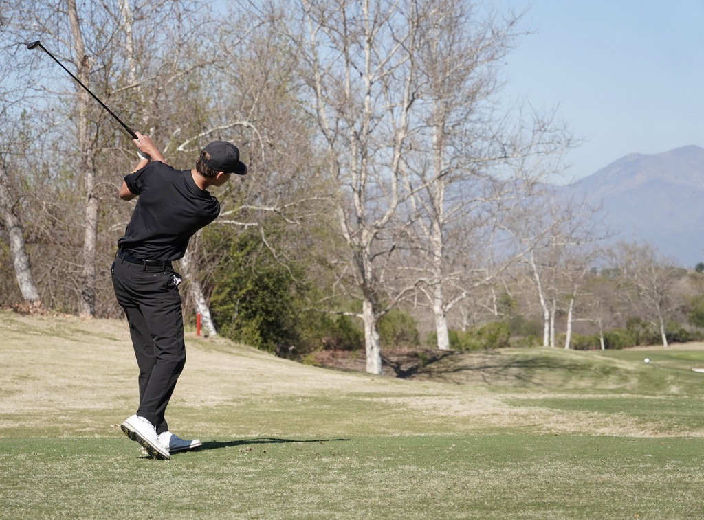 Hollan Breaux with his tee shot on hole one.
