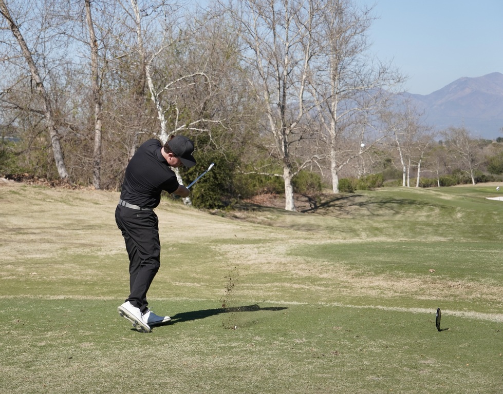 Liam McNamara with his tee shot on hole one.