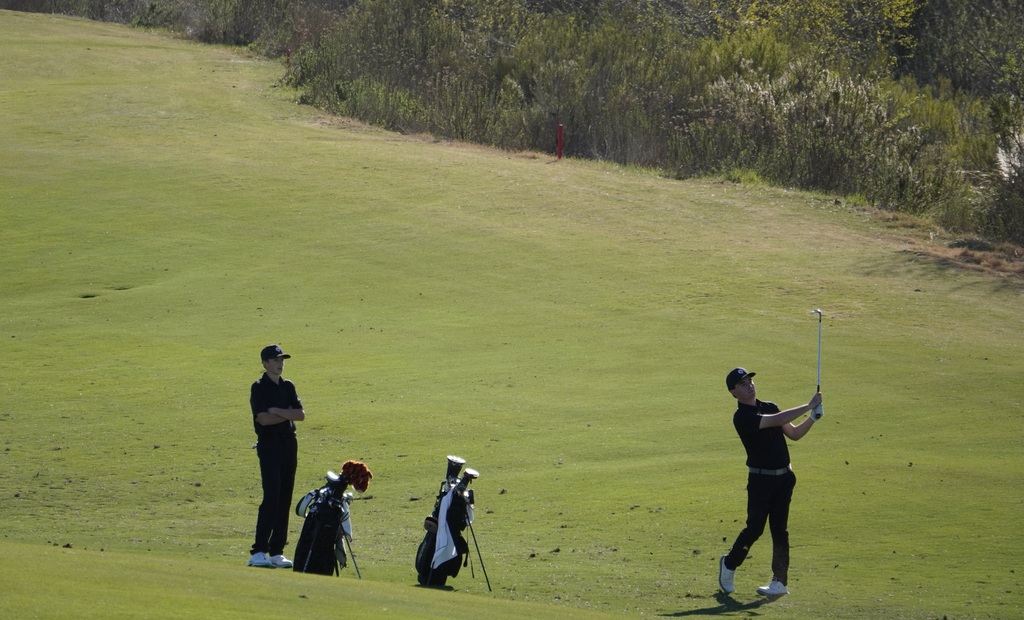 Liam with his second shot into the green on hole 3.  Liam completed the hole with a par.
