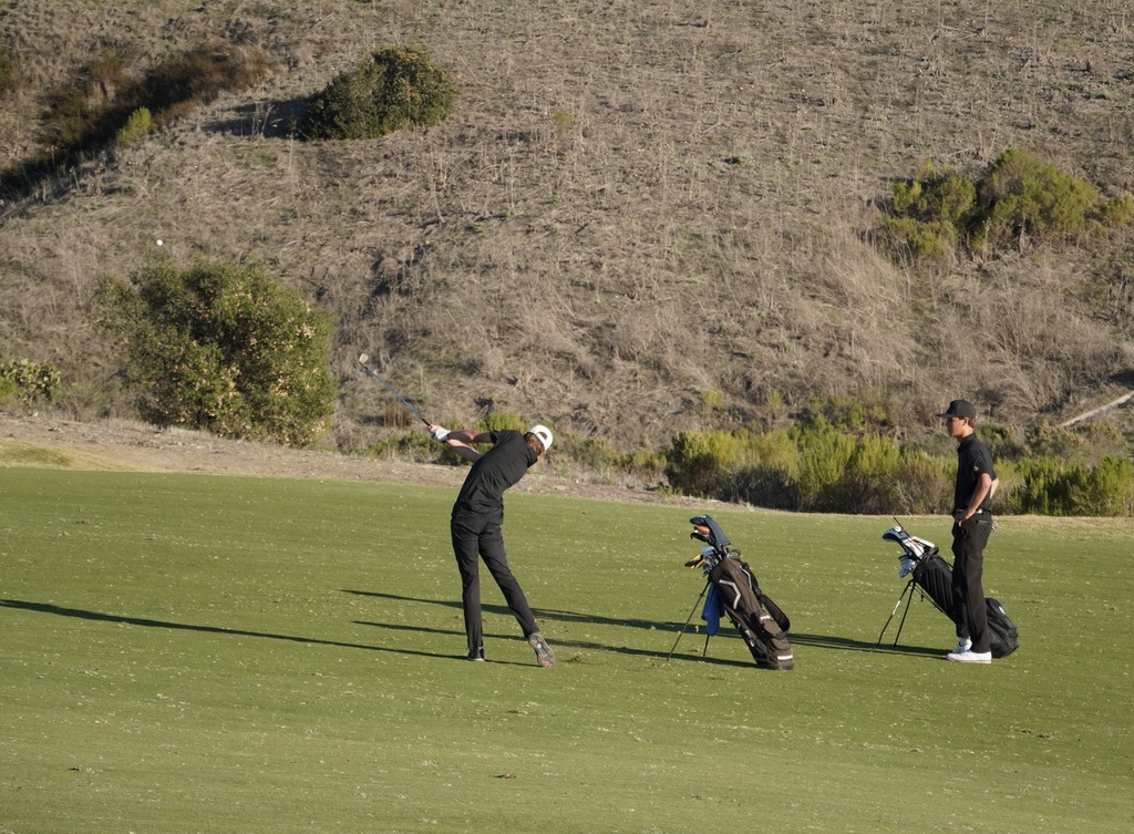 Gianni with his approach shot into the green of hole 9.  Gianni finished the round with a 37 or one over par.