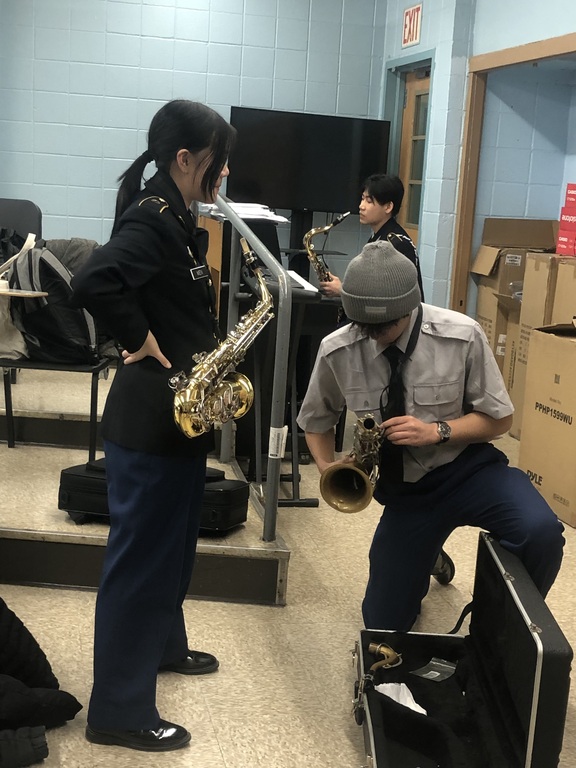Choir cadets prepare their instruments