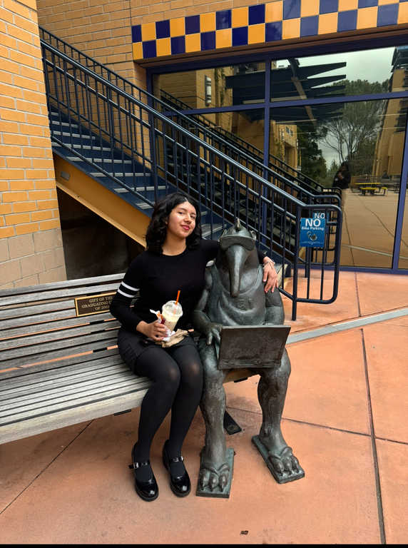alumni atisha posing with the UCI anteater during our break at UCI MUN 💙💛