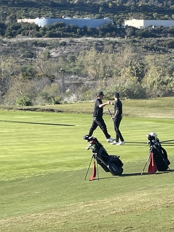 Louie and Paul are congratulating each other on hole 8.