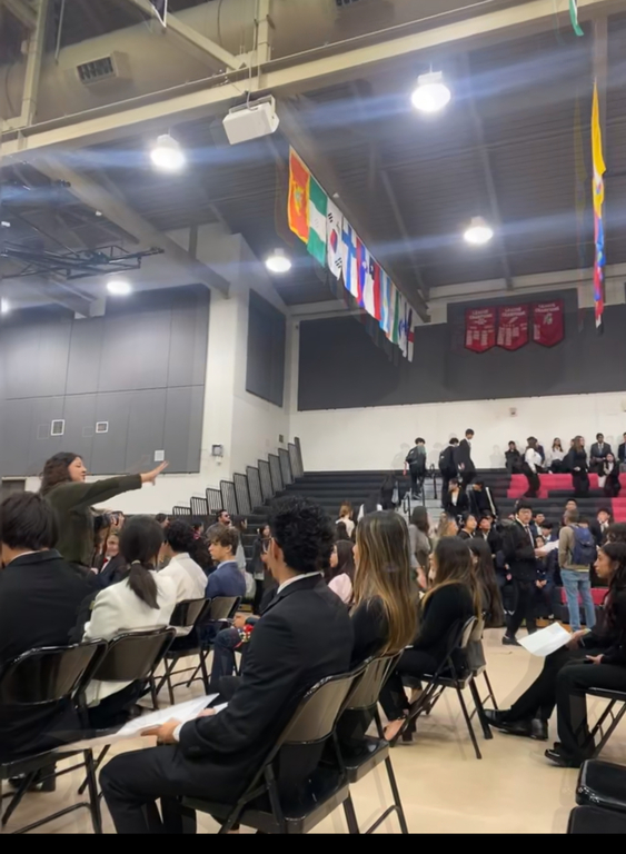 Delegates and chairs getting settled for opening ceremony