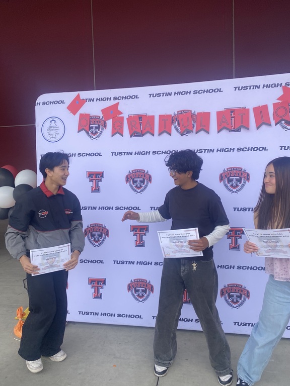 Ellie, Remy, and I receiving award for our academic performance.