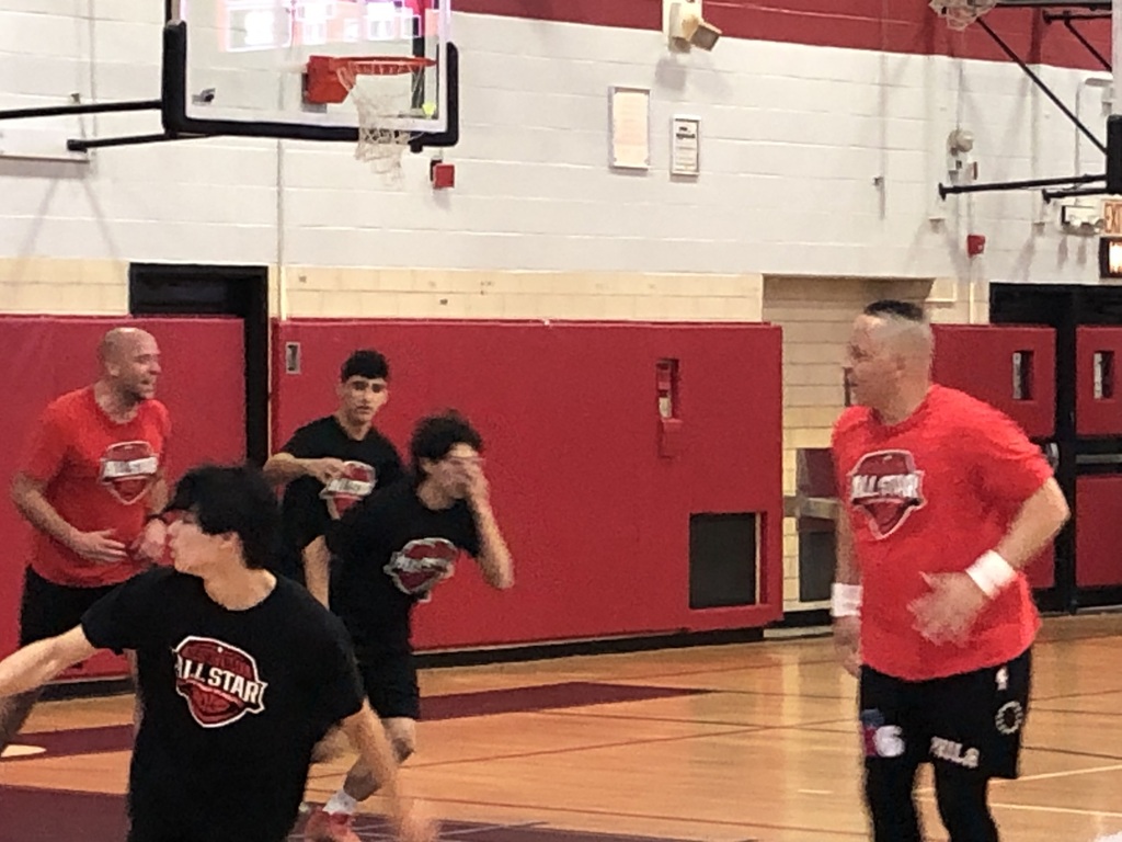 Staff versus student basketball game with Sergeant First Class Dash!