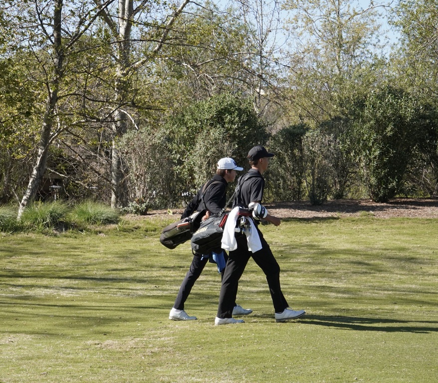 Gianni and Hollan walking down the fairway of hole 1.