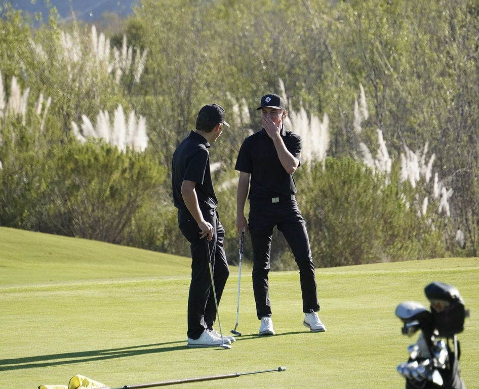 Adam and Finn having a little fun on the putting green of hole 4.