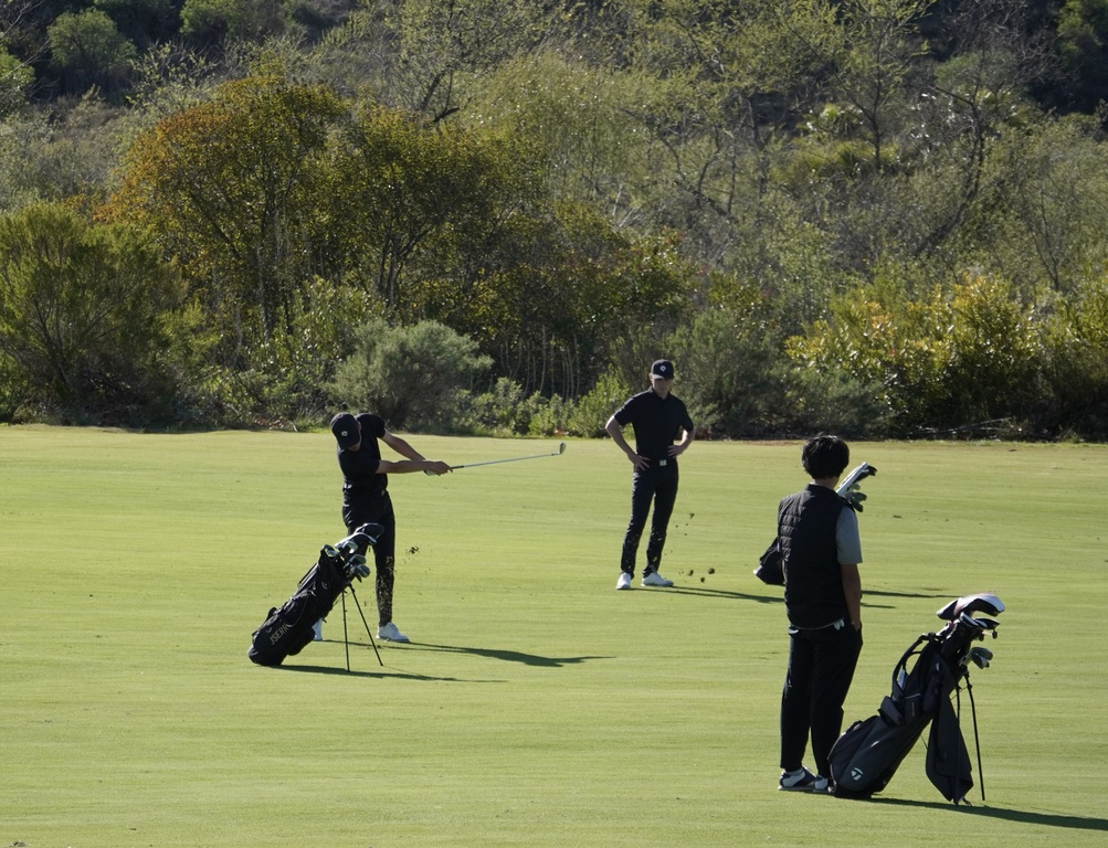 Finn Yeomans with his approach shot into the green of hole 2.  Finn finished this hole with a birdie.