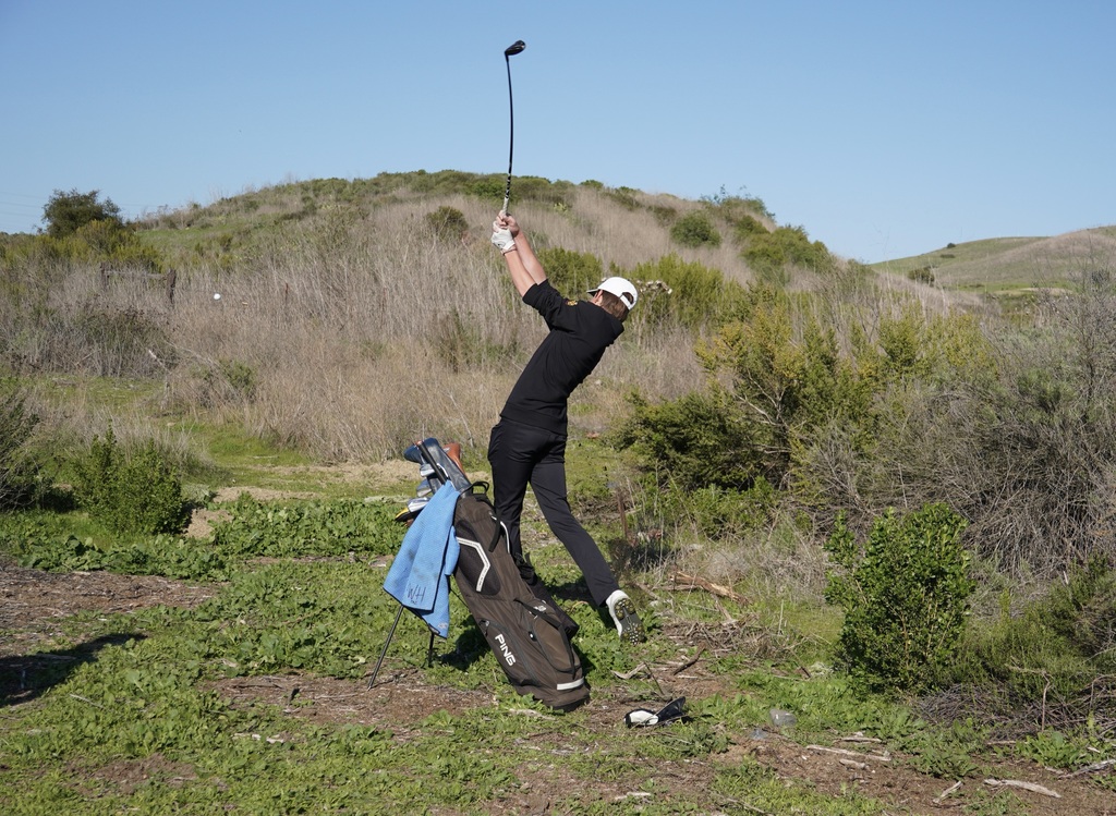 Gianni giving it his all with a rescue shot into the green of hole 3.
