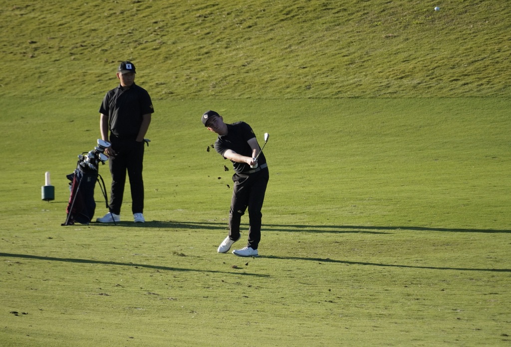 Liam with his approach shot into the green of hole 6.  Liam was able to make birdie on this hole.