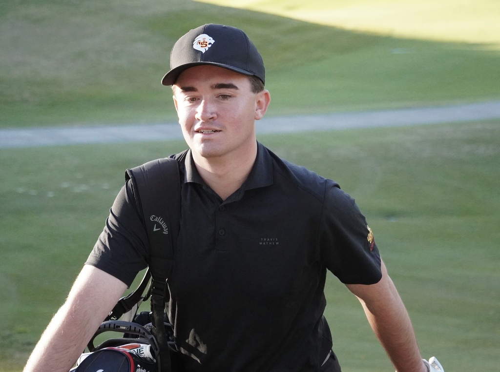 Liam leaving the green of hole 6 looking pleased with his birdie putt.
