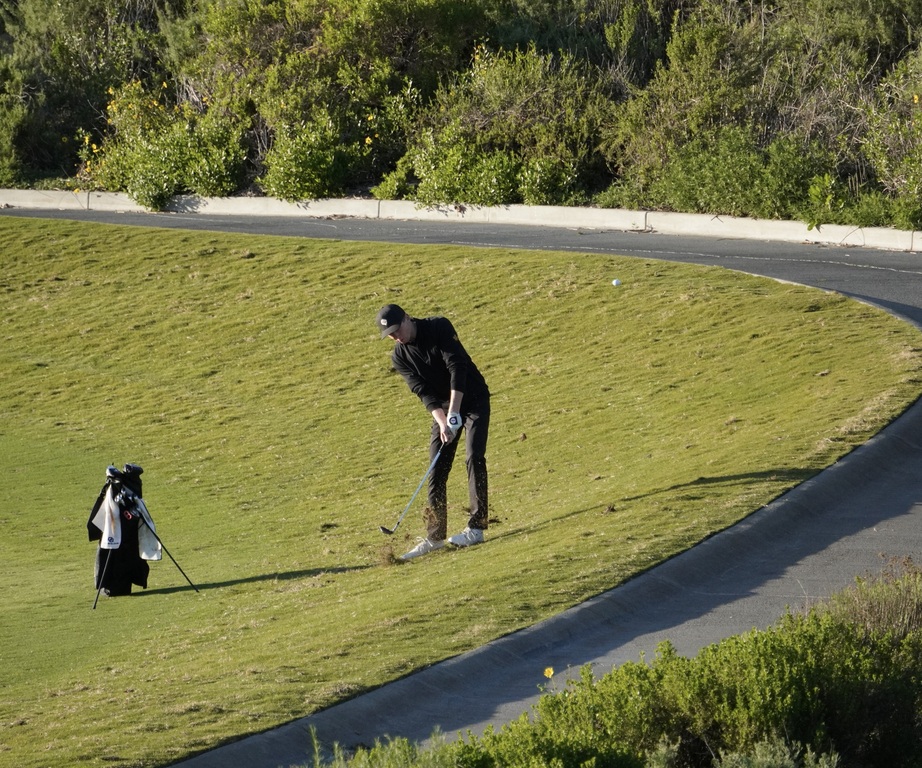 Gavin Heller with his second shot into the green of hole 6.