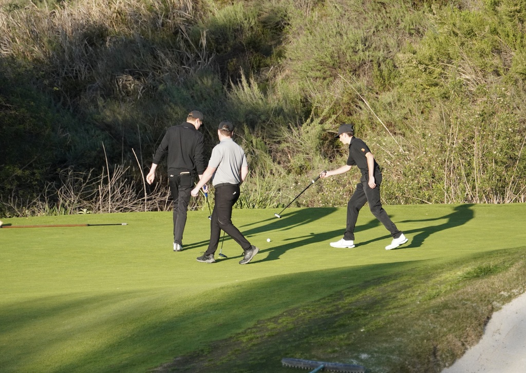Sorting out the putts on hole 6.