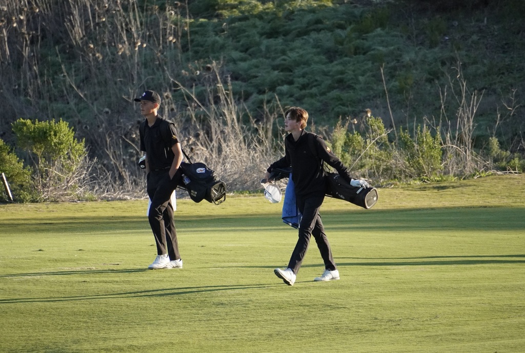 Gianni and Hollan making their way down the fairway of the 9 to finish out the round.