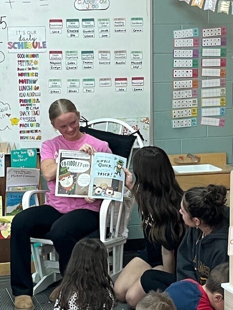 Girls reading to the kids at Musson Elementary