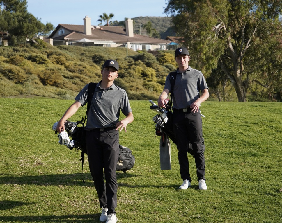 Smug smiles from Finn and Adam coming off the green of hole 8 with an eagle (Finn) and a birdie (Adam).  Nice Job Lions!