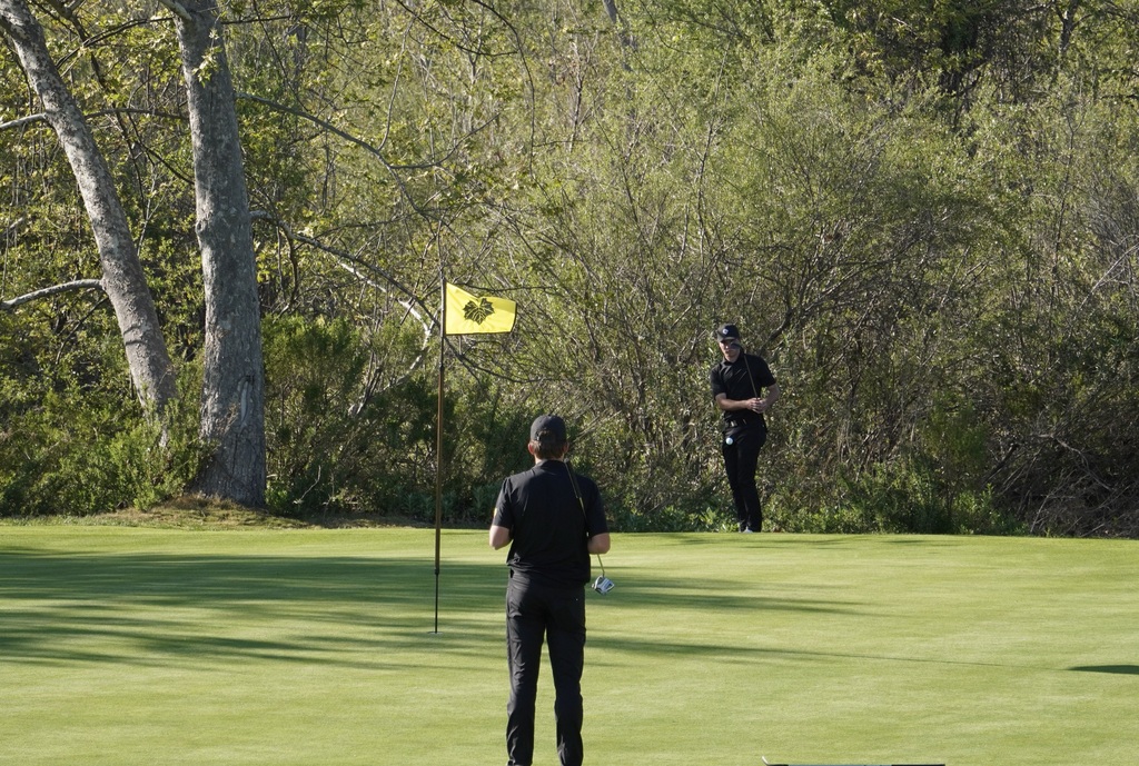 Adam Rusin chipping onto the green of hole 3.