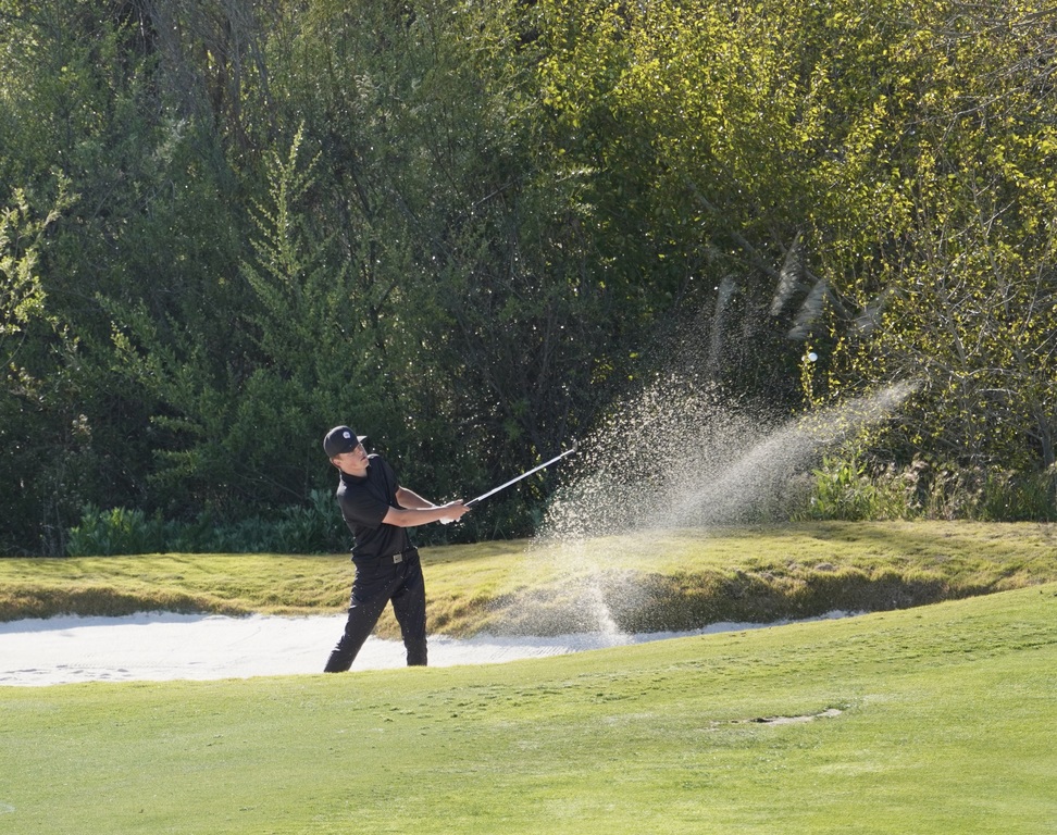 Out of sand and onto the green of hole 3 to save par.