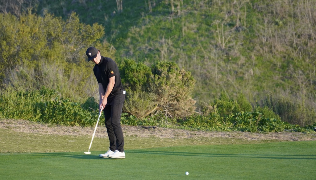 Adam finishing his round with a birdie on hole 9.
