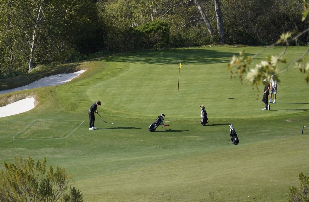 Liam McNamara putting from the fringe of hole 3.  Liam made a par on this hole.