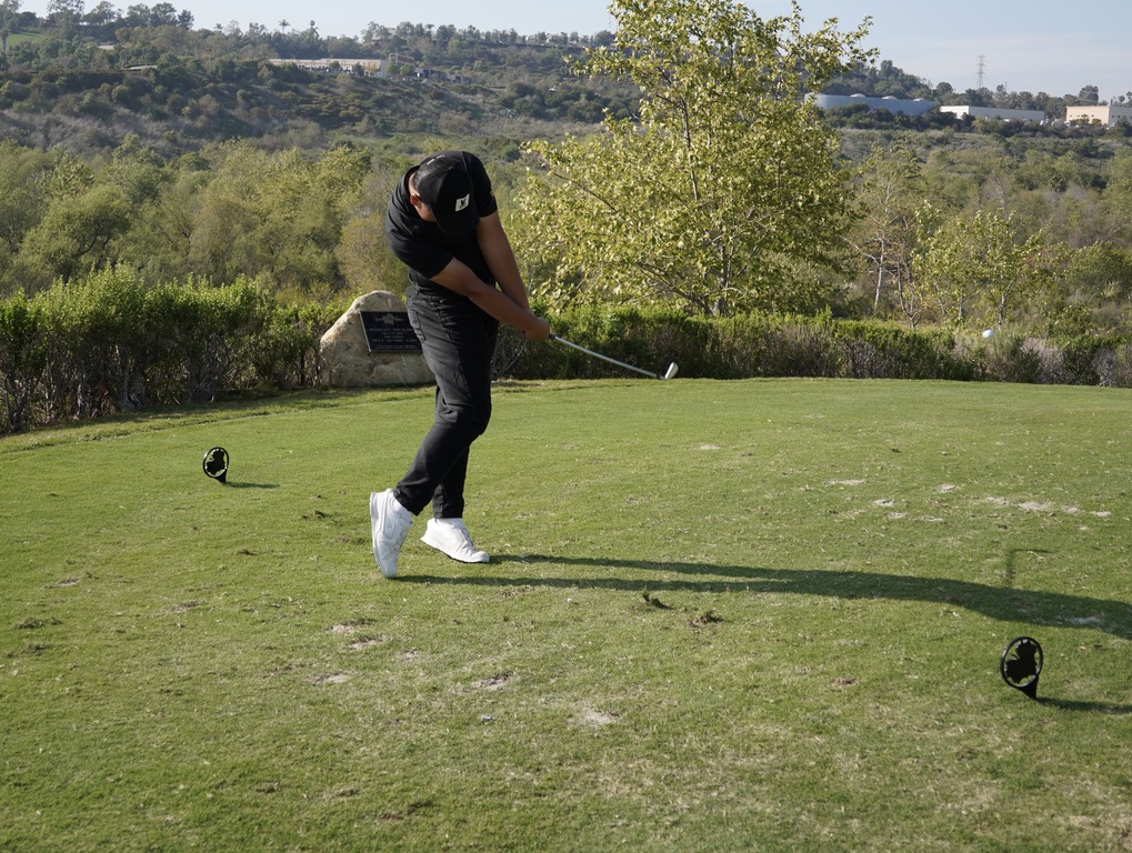 Lucas Li teeing off on hole 4.