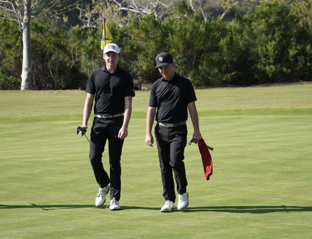 Gavin and Liam exiting the green of hole 1.