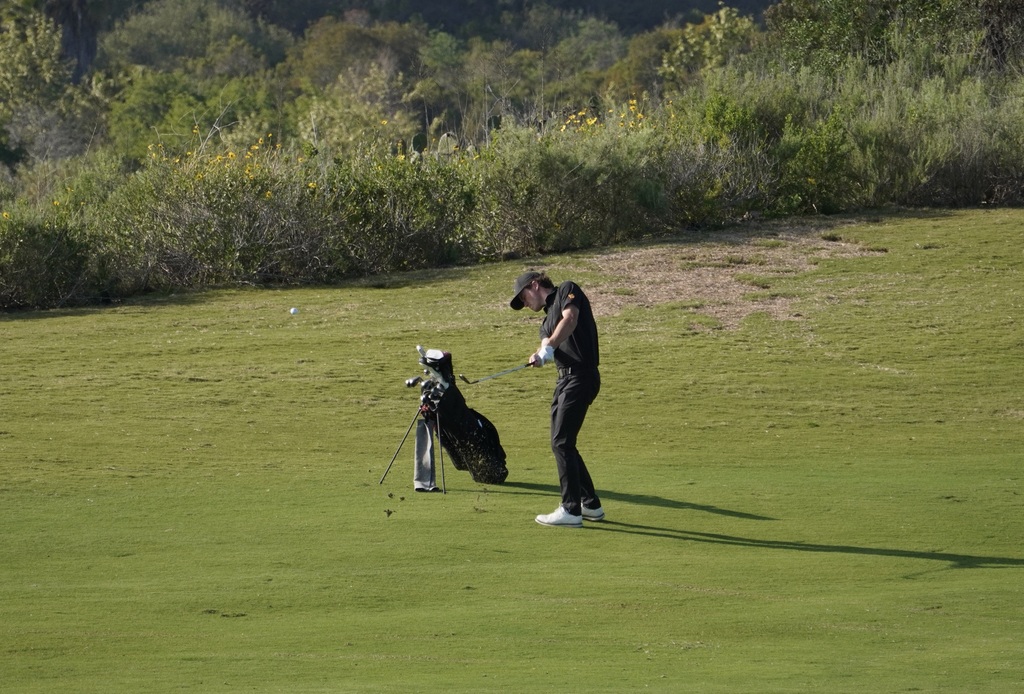 Adam Rusin with his approach shot into the green of hole 7.
