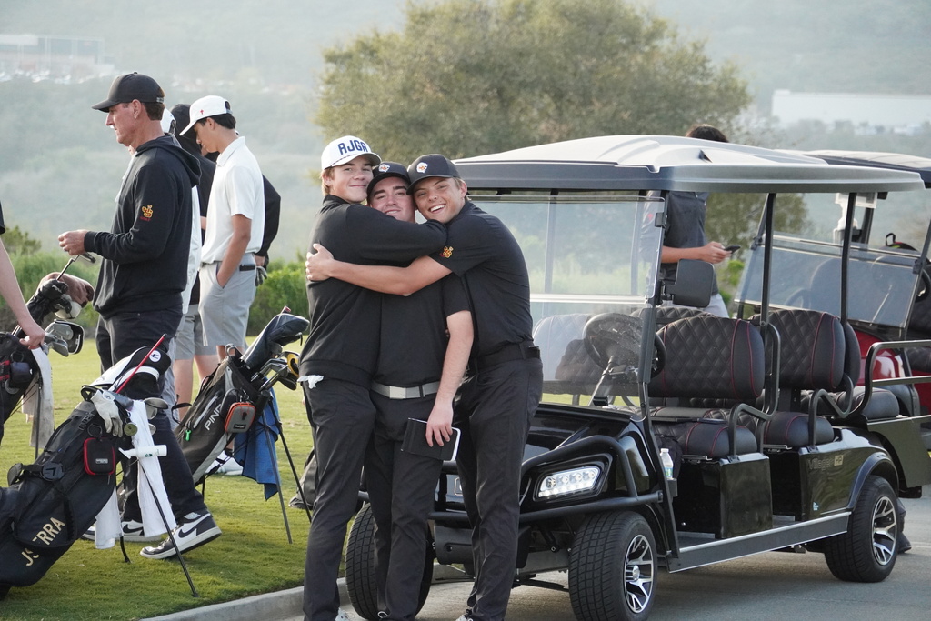 Gianni and Finn giving Liam a much earned hug for being the medalist of the round with a low score of 35 or 1 under par,
