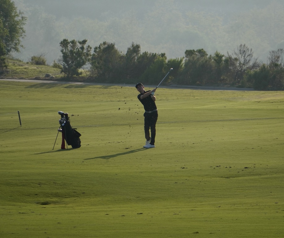 Liam with his approach shot into the green of hole 9 to finish out his round.