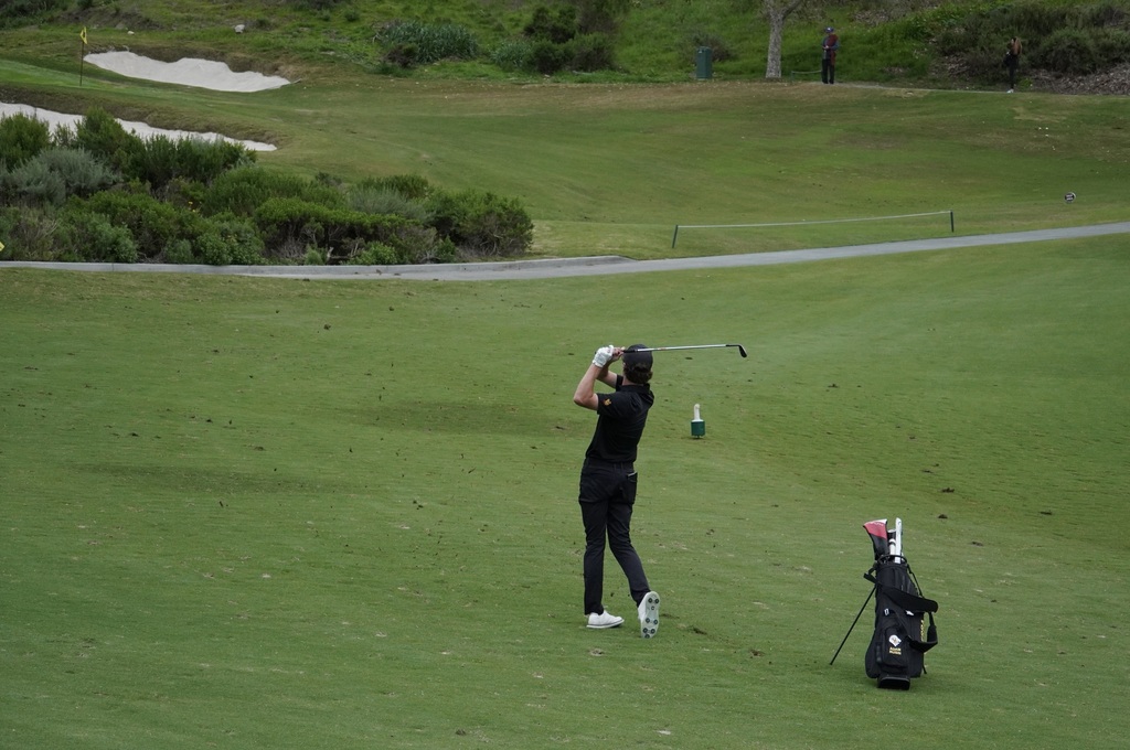 Adam with his approach shot into the green of hole 6.