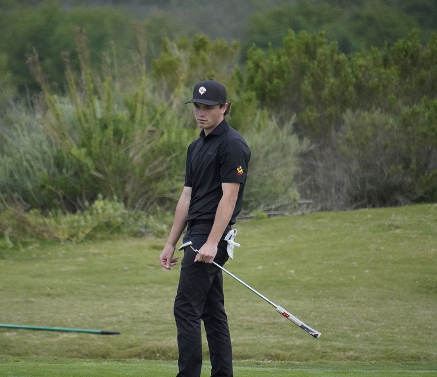 Adam on the green of hole 7.