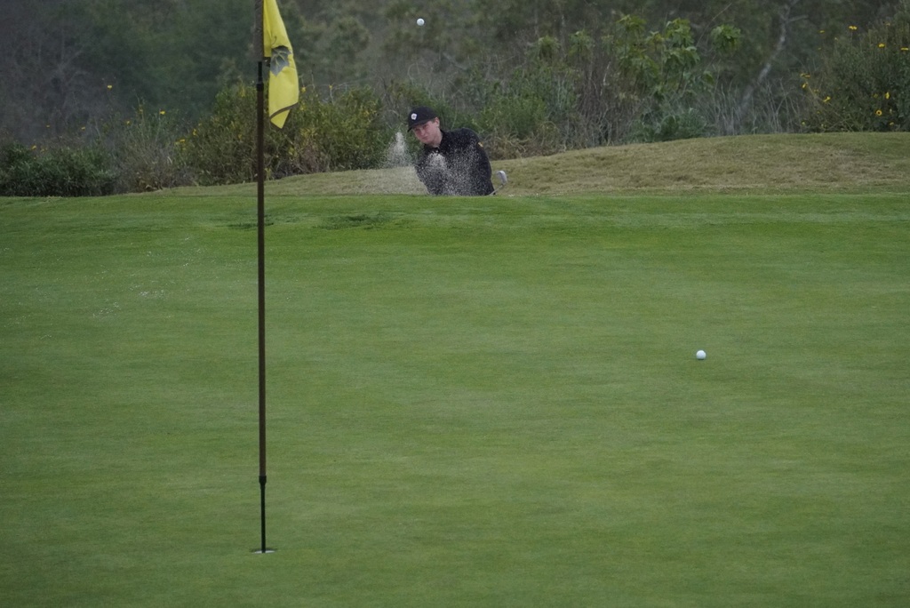 Bunker shot for Gavin Heller on the 7th hole.