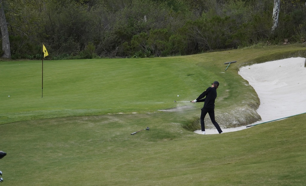 Gianni hitting out of the right side bunker of hole 3.  Gianni was able to make a birdie after landing the shot a foot from the pin.