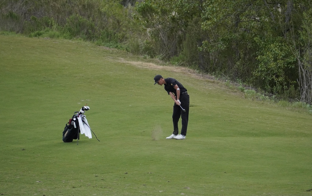 Hollan with his approach shot into the green of hole3.