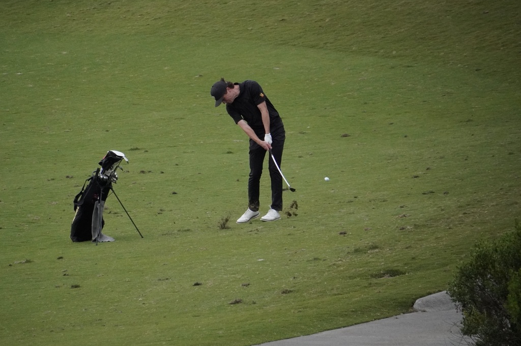 Adam with his approach shot into the green of hole 6.